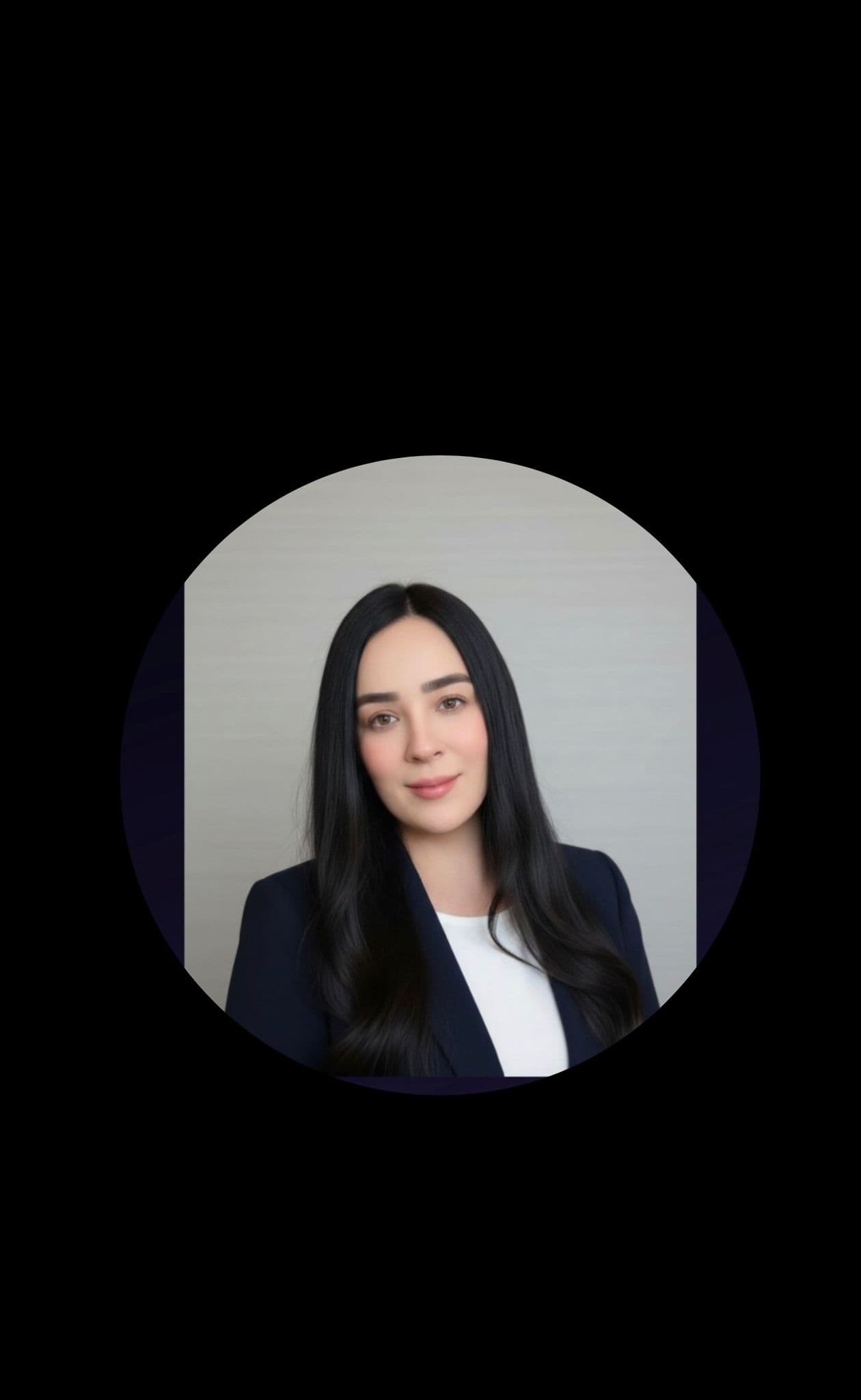 Smiling professional woman with long dark hair in a blue blazer, circular frame.
